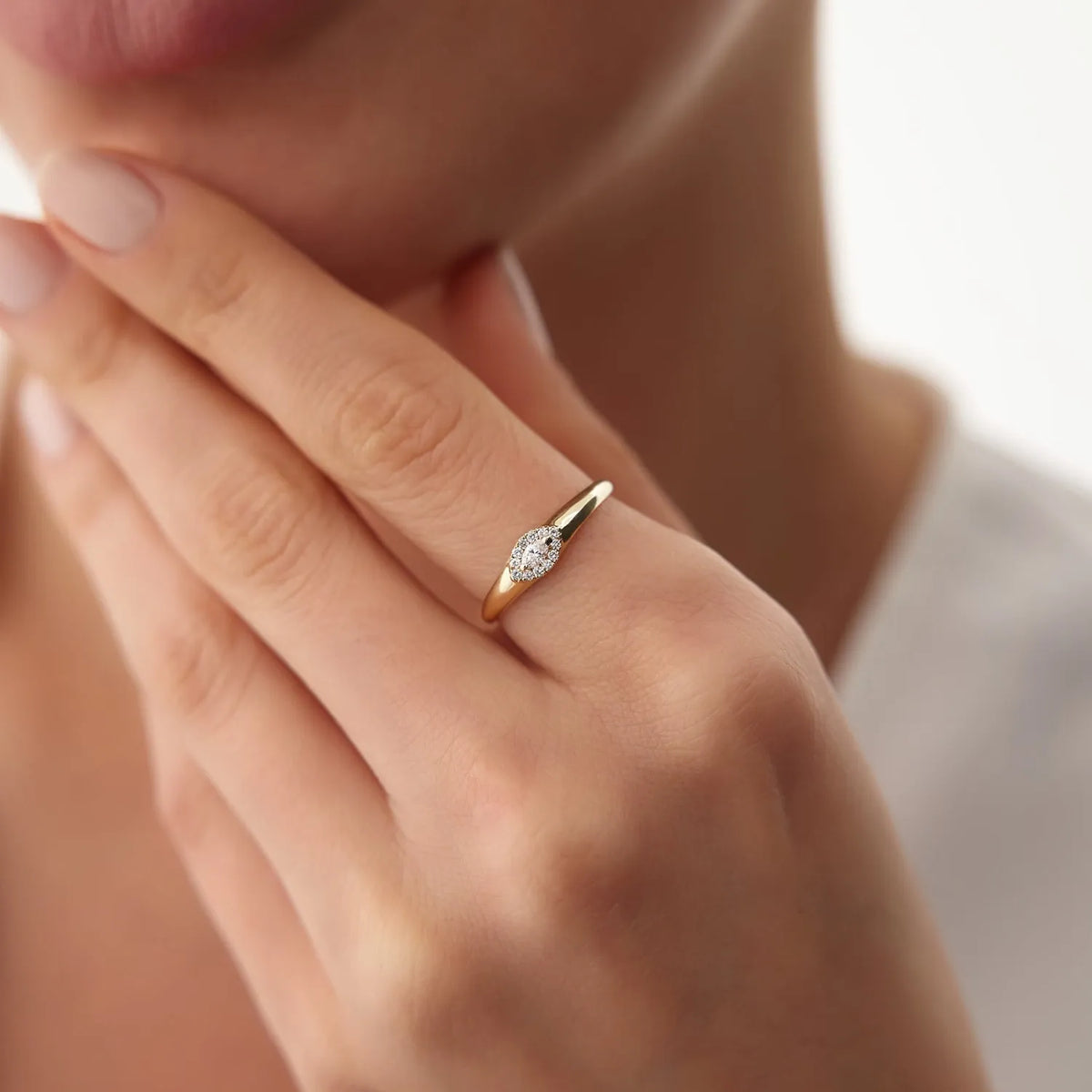 14K Gold Marquise Sapphire and 0.14 Carat Diamond Halo Ring