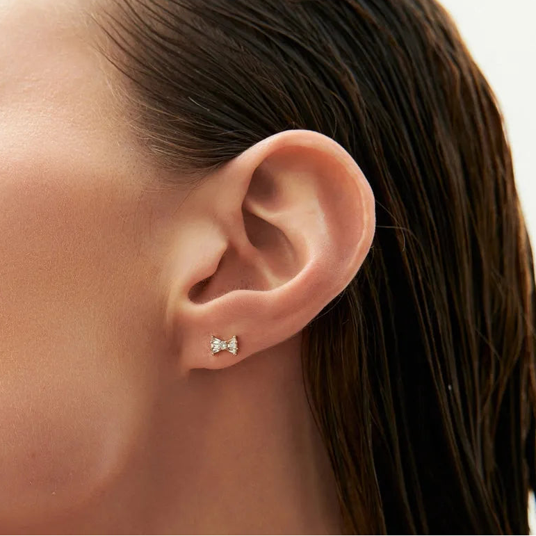 14k Gold Diamond Baguette and Round Cut Bow Stud Earrings 0.25 ctw