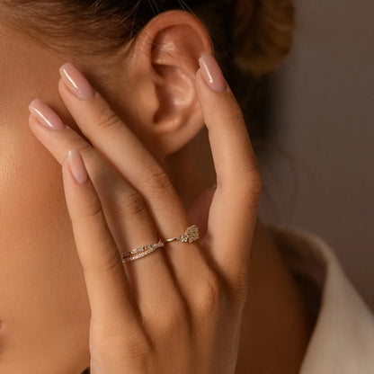 14k Gold 0.49 Carat Round and Baguette Diamond Crossover Ring