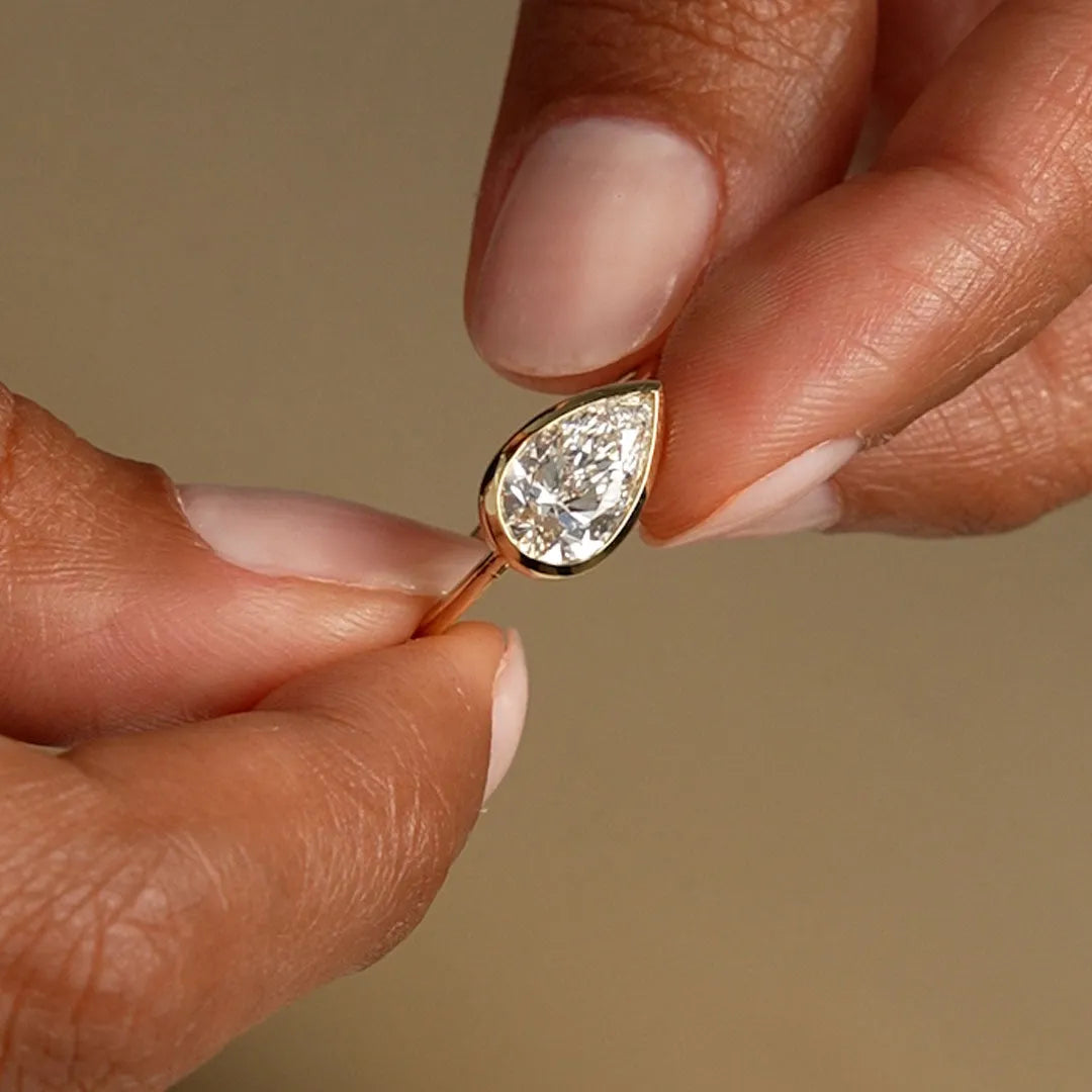 14K Gold 1.50 Carat Lab Grown Diamond Pear Shaped East West Bezel Setting Engagement Ring