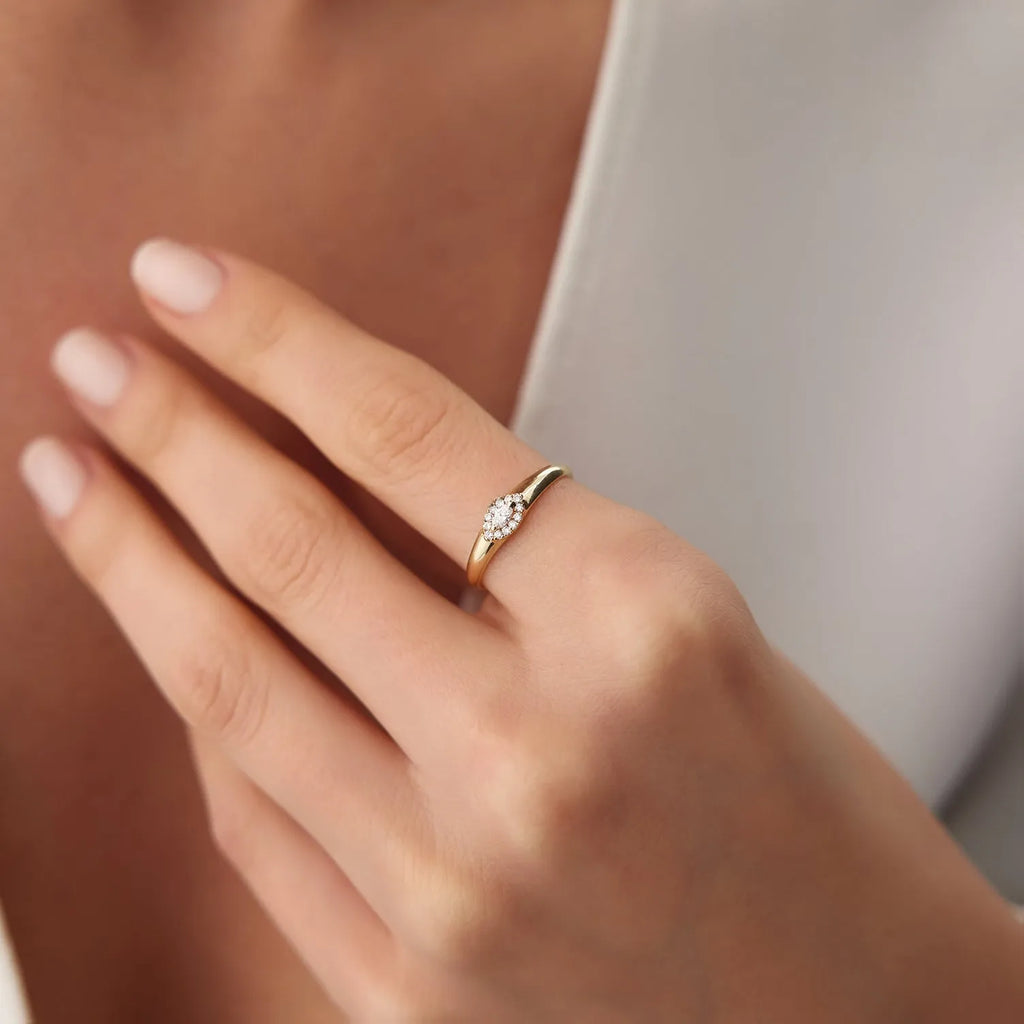 14K Gold Marquise Sapphire and 0.14 Carat Diamond Halo Ring