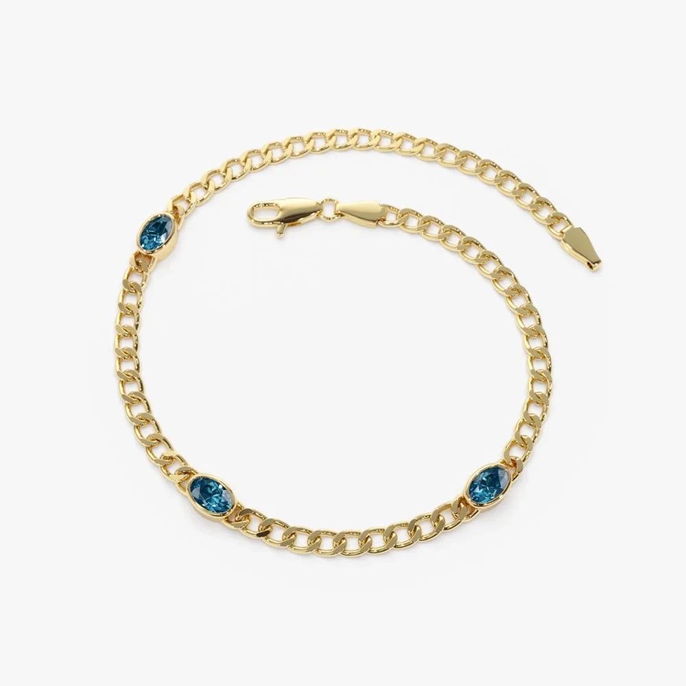 14K Gold Oval London Blue Topaz 3MM Cuban Link Bezel Set Bracelet