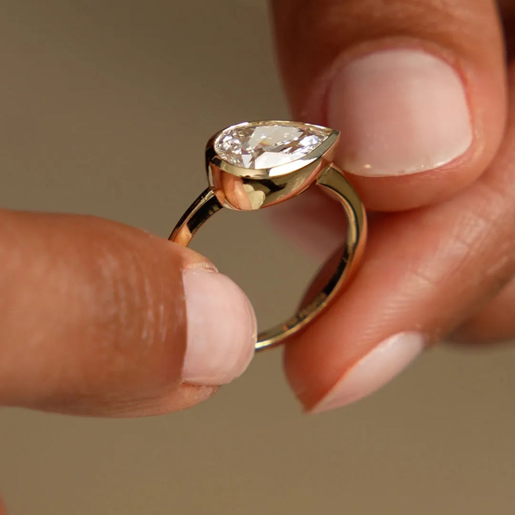 14K Gold 1.50 Carat Lab Grown Diamond Pear Shaped East West Bezel Setting Engagement Ring